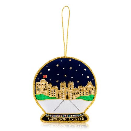 Snow globe with embroidered image of Windsor Castle in the centre. Decorated with gold stars and finished with gems.