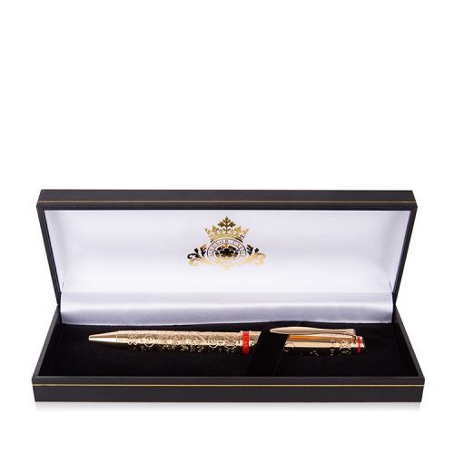 gold plated ballpoint pen with a swirl pattern and printed with 'Buckingham Palace'