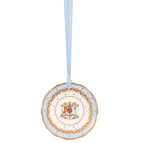 Miniature pale blue plate with gold crown detail. It is  hanging from a pale blue ribbon