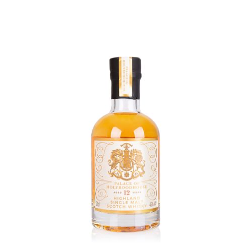 Bottle of whisky with a gold label showing the Scottish Coat of Arms