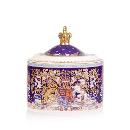 Longest reigning monarch sugar bowl. Oval shaped purple sugar bowl with an ornate crest and the lid has a gold crown