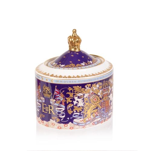 Longest reigning monarch sugar bowl. Oval shaped purple sugar bowl with an ornate crest and the lid has a gold crown