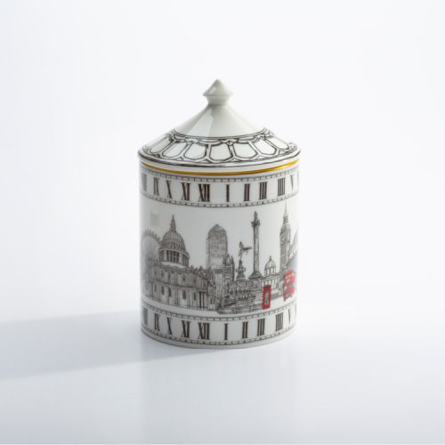 Fine bone English china candle pot depicting black and white sketches of London monuments including London eye, Big Ben and red phone box and red bus. The candle has a lid with a gold gilding edge.
