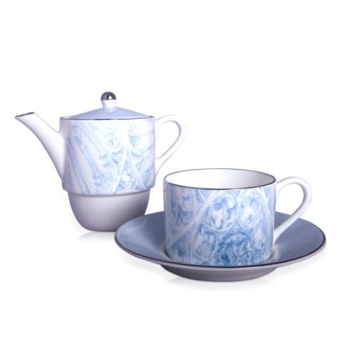 blue and white teapot and teacup and saucer