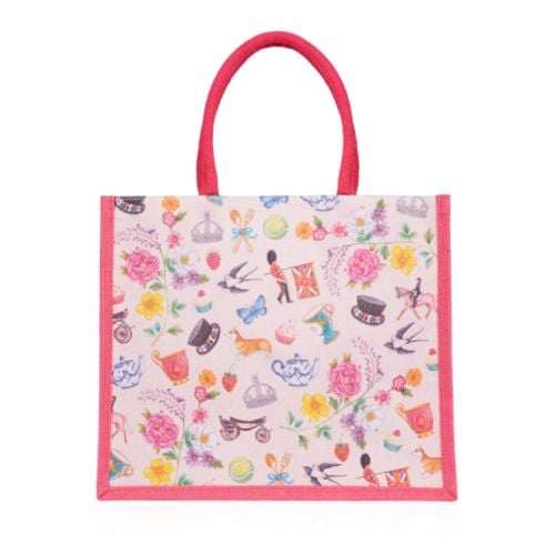 Pink juco bag with pink handles. Bag features whimsical British icons including guardsman, teapots, teacups, horses and crowns.