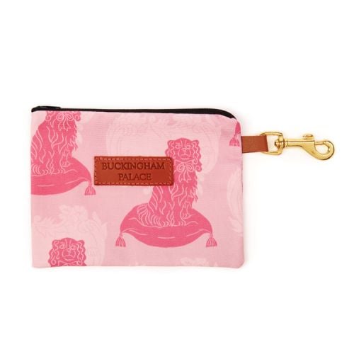 Pet treat pouch printed in a pink dog print with a zip and a leather tag saying Buckingham Palace