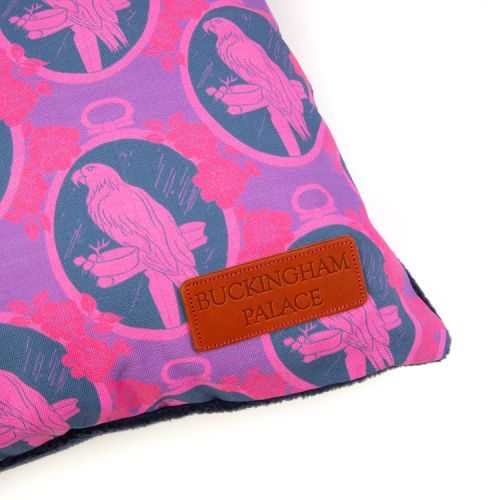 Square pet cushion made with blue and purple parrot material