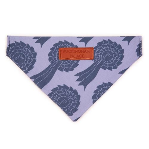 Pet bandana printed with a blue rosette print material. Finished with a leather tag saying 'Buckingham Palace'
