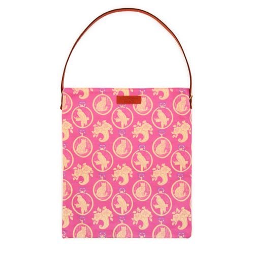 Tote bag with brown leather handle and brown leather tag saying 'Buckingham Palace'. Made using a pink material printed with yellow parrot and cats.
