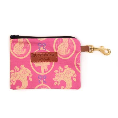 Pet treat pouch printed in a pink material printed with yellow and pink cats with a zip and a leather tag saying Buckingham Palace