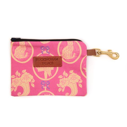 Pet treat pouch printed in a pink material printed with yellow and pink cats with a zip and a leather tag saying Buckingham Palace