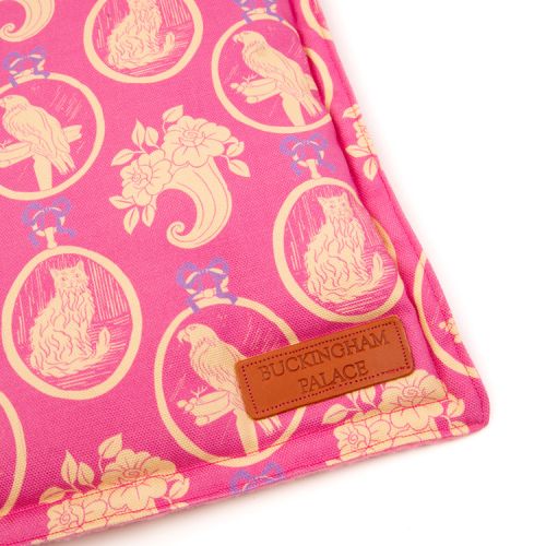 Square shaped pet blanket made using pink material and printed with yellow cats and parrots