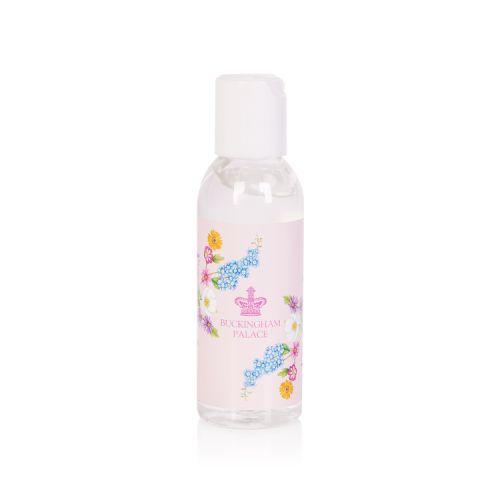 Practical hand sanitiser presented in a clear bottle with a pretty pink floral design. At the centre is a  pink coronet above to words Buckingham Palace