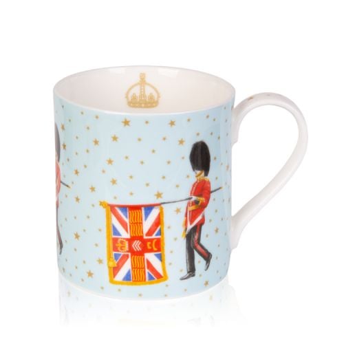 Pale blue mug decorated with guardsmen and flag. On the blue background are gold stars and on the inside of the mug is the gold coronet