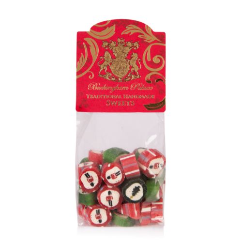 Clear bag of green and red sweets printed with a guardsman. The bag is closed with a red and gold label.