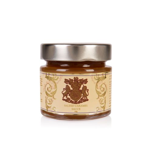 Glass jar of caramel sauce with a gold label displaying the crest