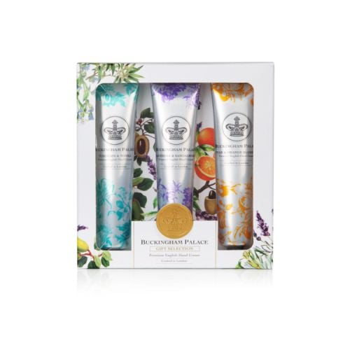 Three tubes of hand creams in a silver tube and printed with a crown. Each tube is decorated with a turquoise, orange or purple design of the ingredients.