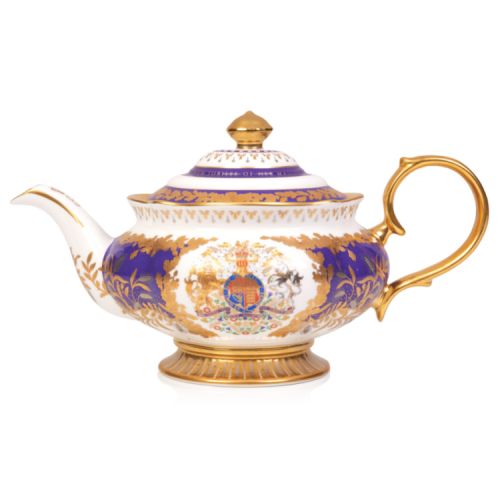 Teapot featuring a gold handle and a coat of arms at the centre. The base and lid are gold and the teapot features a purple and gold leaf design throughout.