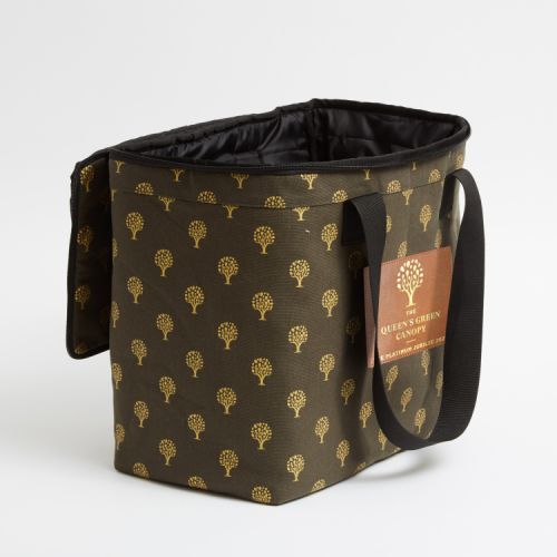 Green cooler bag printed with gold trees and a leather label printed with the words 'The Queen's Green Canopy The Platinum Jubilee 2022'