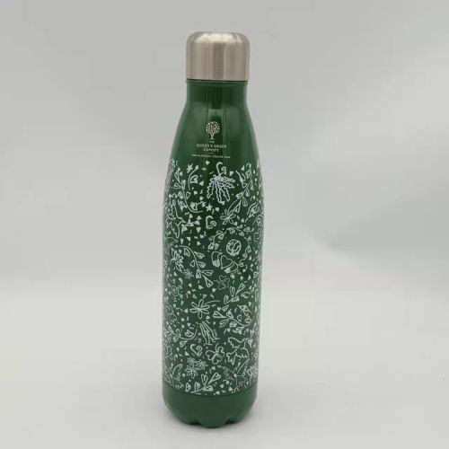 Green metal water bottle decorated with a white floral illustration.