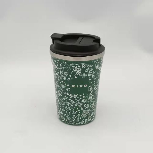 Green coffee cup with a white illustrated floral design. With a black lid and the word 'Rixo' printed on the front