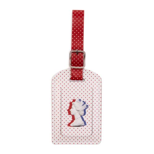 White and red leather luggage tag with a polka dot design and the Machin design of The Queen's silhouette. 