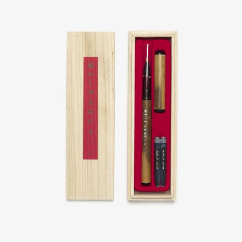 Bamboo calligraphy set in a wood box with a red lining