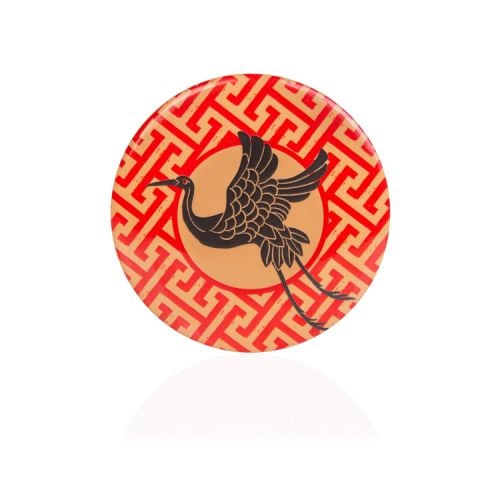 Red and yellow pocket mirror featuring a crane
