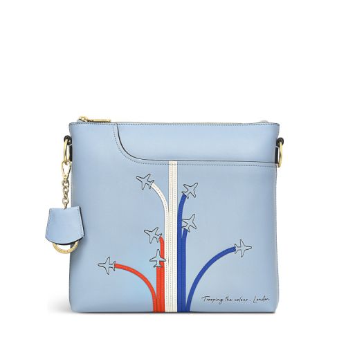 Blue leather bag depicting planes with red, white and blue trailing behind.