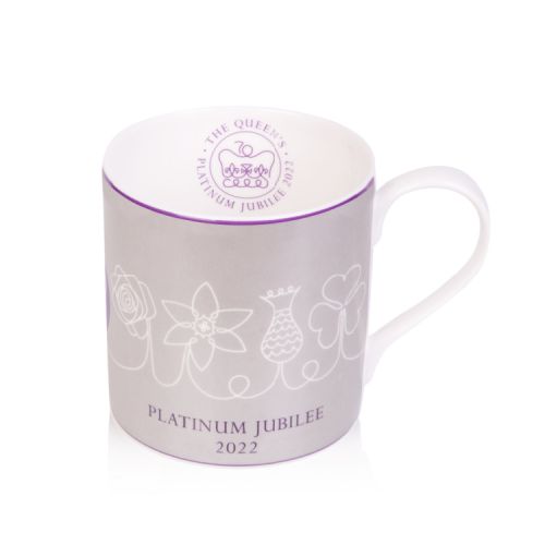 Silver coffee mug with a white floral design and the words 'Platinum Jubilee 2022' printed at the base