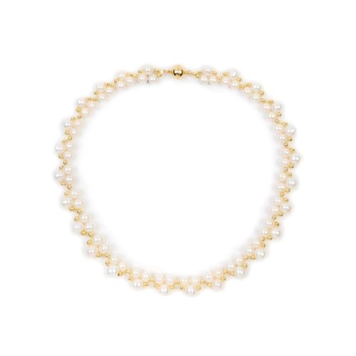 Single strand necklace with trios of pearls and gold beads covering the length.