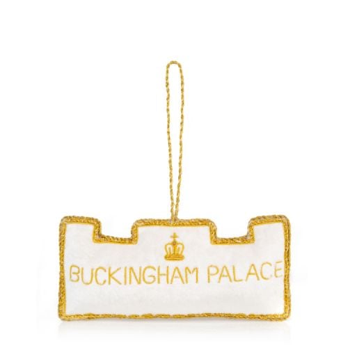 Front facade of Buckingham Palace made of white velvet. Gold embroidery detail and crystals.