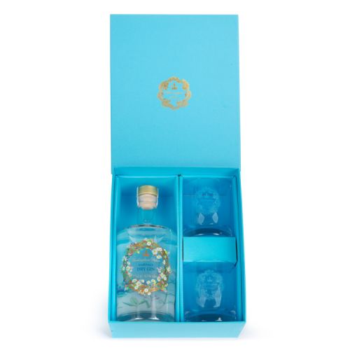 Blue gift box with lid. Contents are a bottle of dry gin and two tumblers