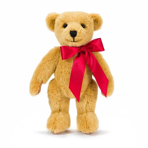 Classic teddy bear with red ribbon. Exclusive for Buckingham Palace. Both feet have embroidered labels.