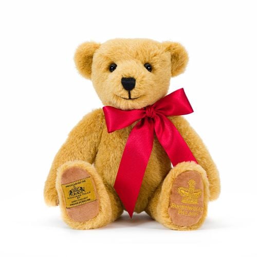 Classic teddy bear with red ribbon. Exclusive for Buckingham Palace. Both feet have embroidered labels.