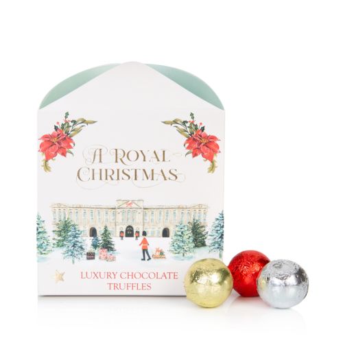 square packaging of truffles including buckingham palace on the front and gaurdsman pulling a dog on sleigh