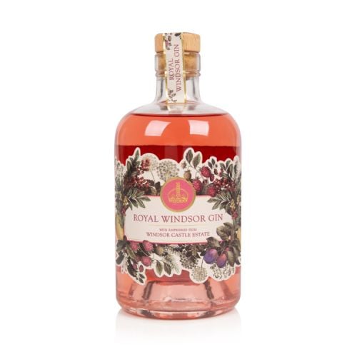 Front of pink gin bottle. Clear glass bottle with cork stopper. Label is illustrated with botanicals and flowers that are included in the drink.