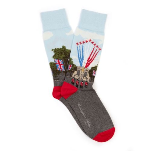 Pair of socks with scene of Buckingham Palace with trooping of the colours above. 