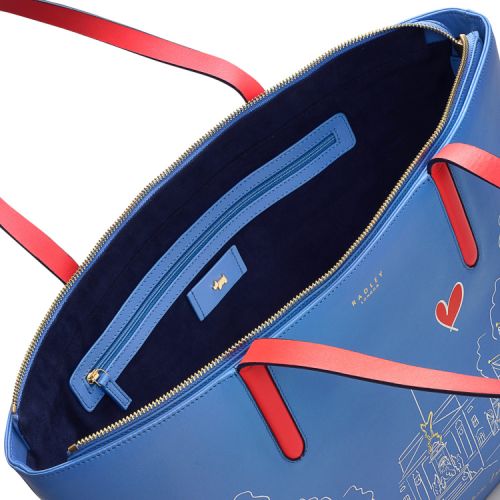 Front of blue tote bag. With red handles and swing tag. Illustration of Buckingham Palace and applique Scottie dog and Guardsman.