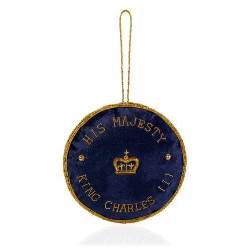 Navy round decoration with gold embroidery of CIIIR and a crown. 