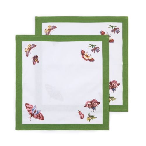 2 white napkins with green border and butterflies