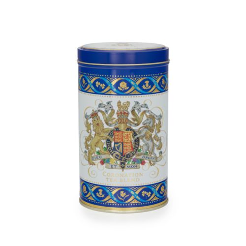Tea caddy with blue lid and the Royal coat of arms at the centre.