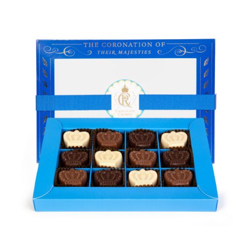 12 crown chocolates presented in blue box with blue ribbon and gold foil writing and embellishments.