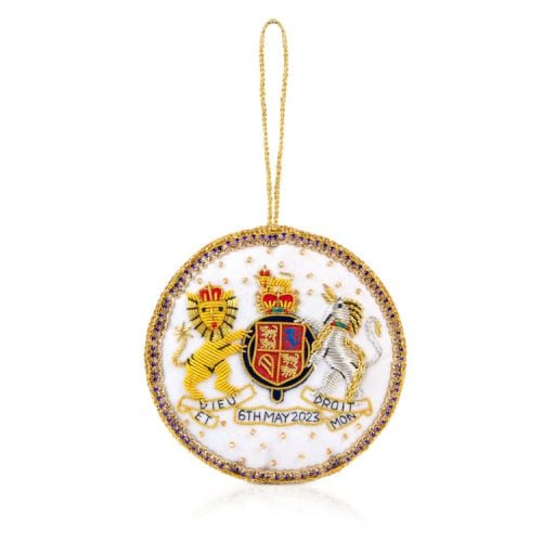 White decoration with gold beading and colourful embroidery. Featuring the Royal coat of arms and date of the Coronation.