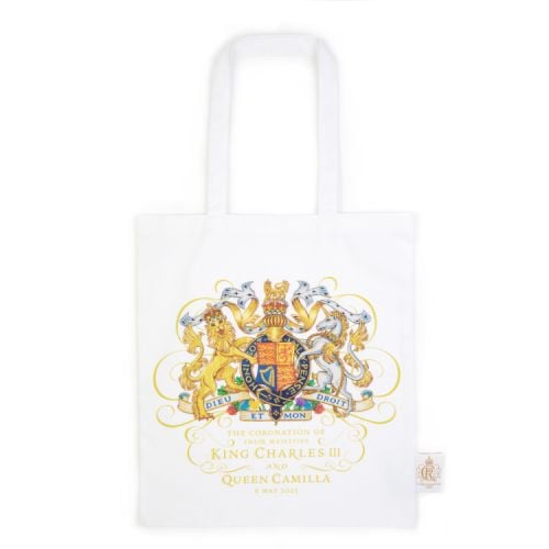 White tote bag with coat of arms and text.
