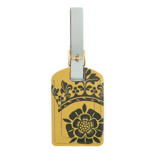 Green luggage tag with gold detailing on buckle strap. Windsor Castle wording in gold foil and windsor crest illustration.