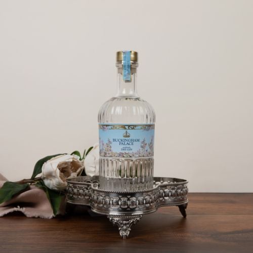 Buckingham Palace Dry gin. With blue floral label and texture clear glass bottle. 