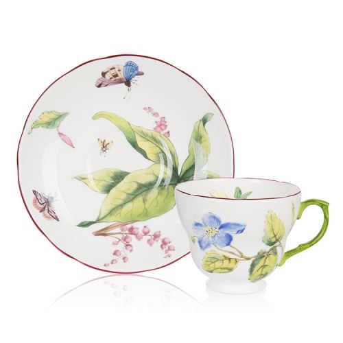 Chelsea fine bone china teacup and saucer with a design featuring  botanical paterns on both pieces and in the inner side of the cup. Displayed with presentation gift box.