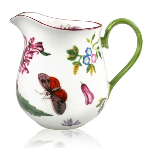 Chelsea porcelain milk jug with leaves, butterflies and flowers. Green handle and finished with a red rim.