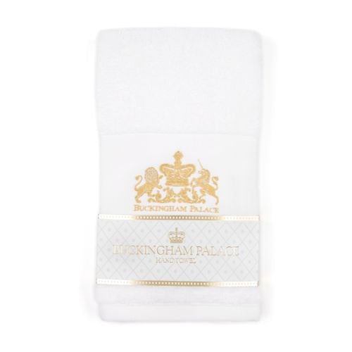 White hand towel with gold embroidered coat of arms at the centre. Wrapped with white and gold label. 